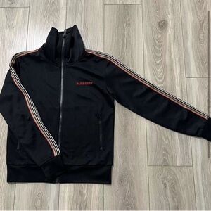 BURBERRY ICON STRIPE DETAIL FUNNEL NECK TRACK TOP IN BLACK